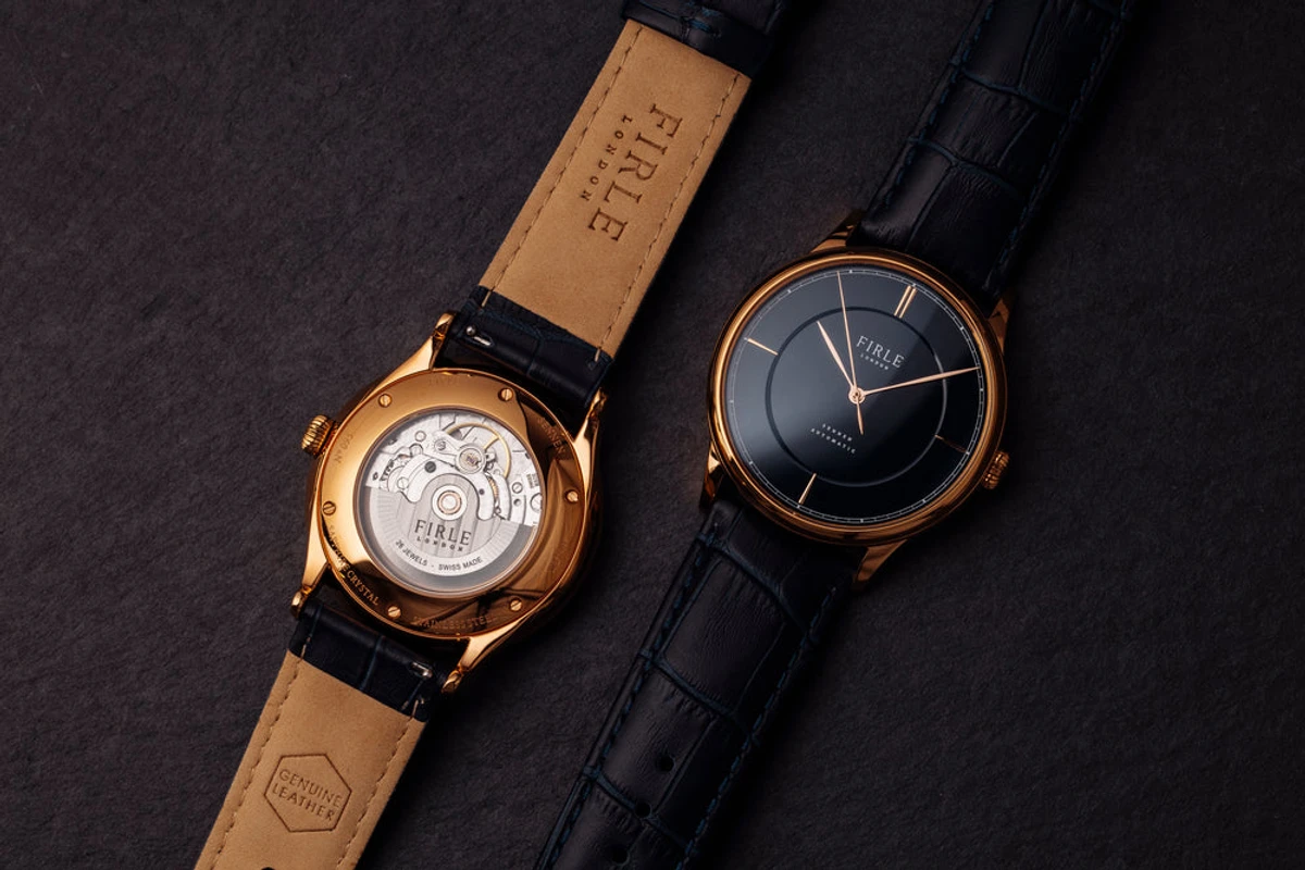 Swiss STP1-11 automatic movement with custom FIRLE engraved rotor and 26 jewels
